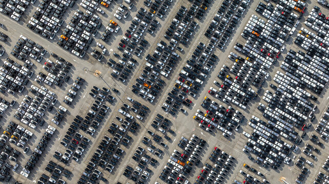 Aerial view new car lined up, Automobile automotive car parking lot commercial business industry,  Port of import export business logistic dealership, New cars global business logistic import export.