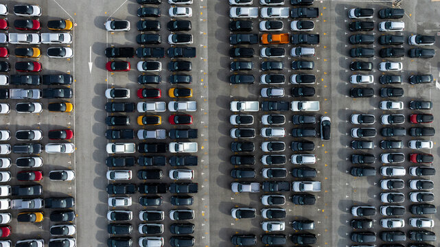Aerial view new car lined up, Automobile automotive car parking lot commercial business industry,  Port of import export business logistic dealership, New cars global business logistic import export.