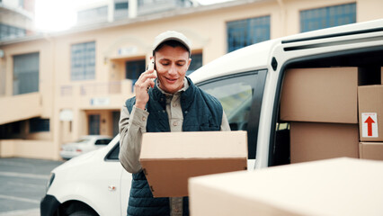 Logistics, delivery man and phone call with box outdoor for parcel arrival, verify address or smile. Transit, worker and mobile chat with package at van for unit directions, courier service or export © peopleimages.com