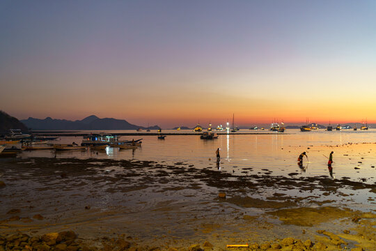 sunset on the beach of labuan bajo 