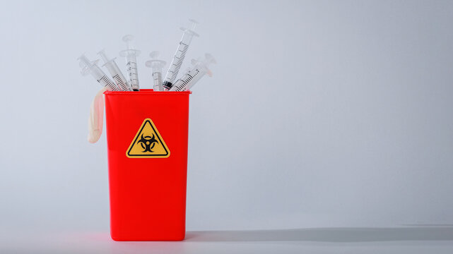 Medical disposal red container syringe healthcare waste management show serious alarming concern for hazardous plastic supply safety clean