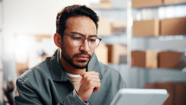 Glasses, man and logistics worker with tablet in office with research, inventory or online order. Thinking, cargo service and supply chain manager with digital technology for delivery information.