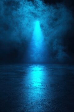 Blue neon spotlight illuminates smoke and wet floor in dark scene