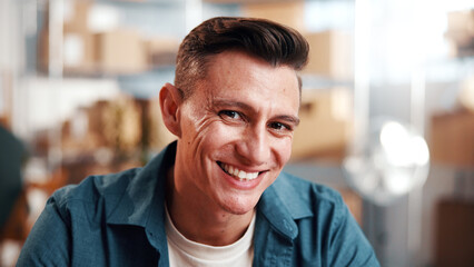 Fototapeta premium Man, smile and portrait in small business for supply chain, ecommerce or distribution service. Entrepreneur, supplier and happy in workshop for export, startup growth or stock inventory for logistics