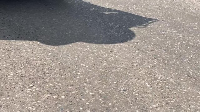 Close up of heavy truck dual wheels rolling on asphalt road