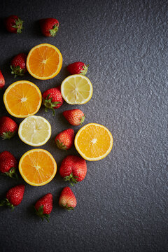 Fresh strawberries, oranges, and lemons
