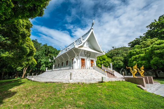 Beautiful white church nestled in a valley within Wat Tham Phra Bodhisattva in Saraburi Province, Thailand.