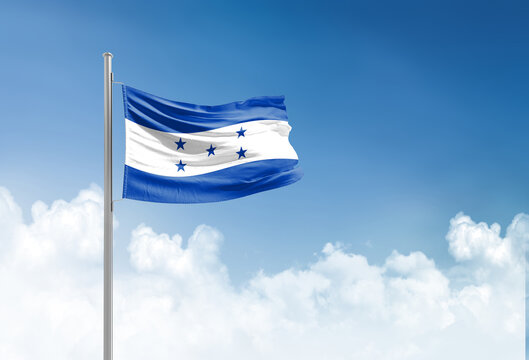 Honduras flag waving in beautiful sky.