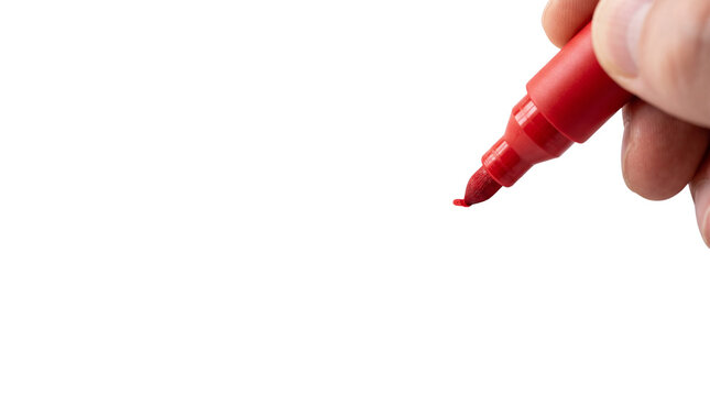 Red marker held by hand on white background. Person writing with felt tip pen. Close up of hand holding red permanent marker.