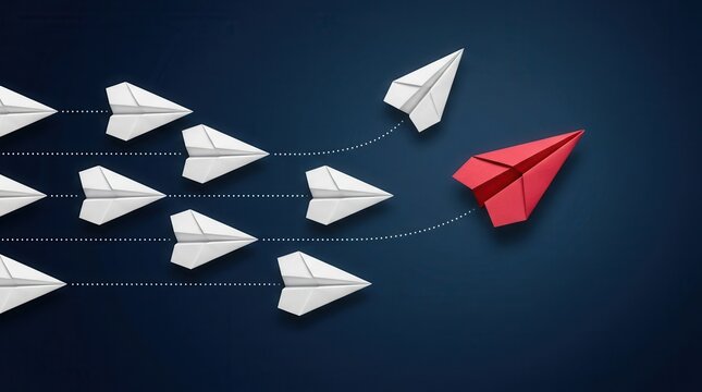 Red paper airplane changing direction away from white airplanes on a dark blue background.