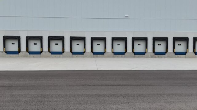 Modern logistics warehouse with a row of empty loading docks