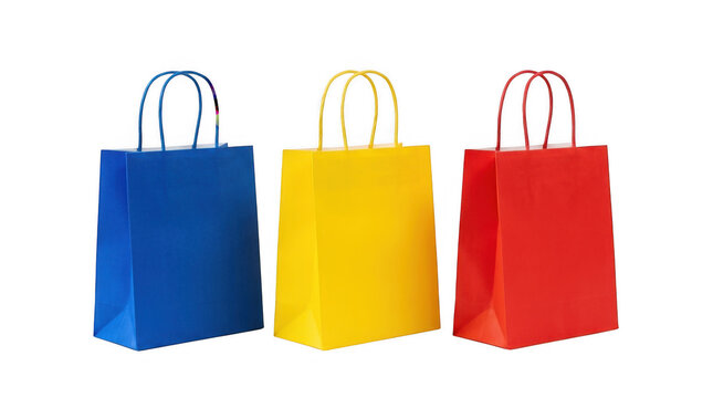 Three colorful paper shopping bags in blue yellow and red isolated on transparent background
