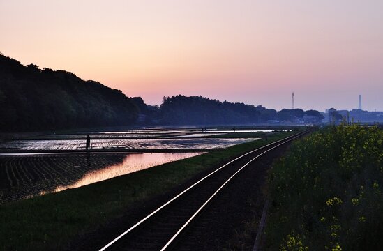 Twilight Landscape with Railway Tracks and Spring Rice Fields in Hitachinaka, Japan