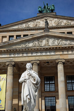 Poetic grandeur in stone: The impressive Friedrich Schiller monument standing before Berlin&rsquo;s historic Konzerthaus on Gendarmenmarkt.