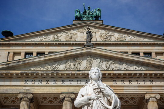 Poetic grandeur in stone: The impressive Friedrich Schiller monument standing before Berlin&rsquo;s historic Konzerthaus on Gendarmenmarkt.