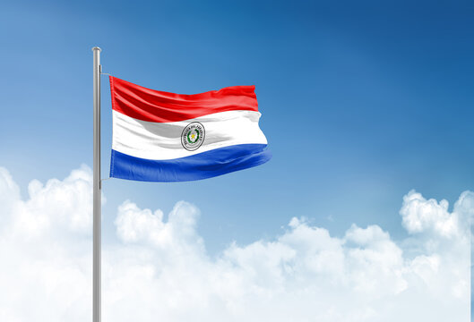 Paraguay flag waving in beautiful sky.