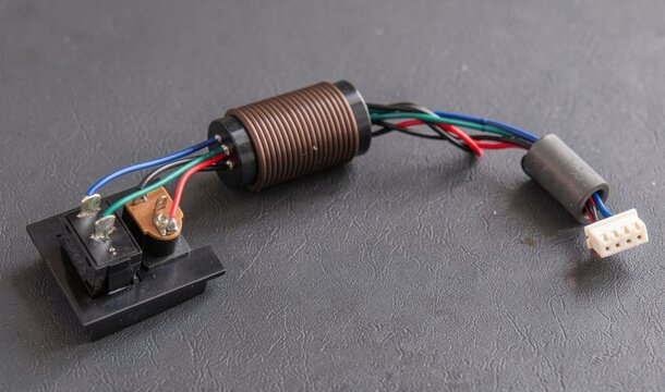 Wire harness with inductor coil and switch on textured background