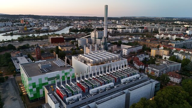 Aerial view of the Keppel Data Center Reit facility with modern rooftop cooling units and a green patterned facade, located in an urban industrial area in Offenbach am Main, Hessen, Germany.