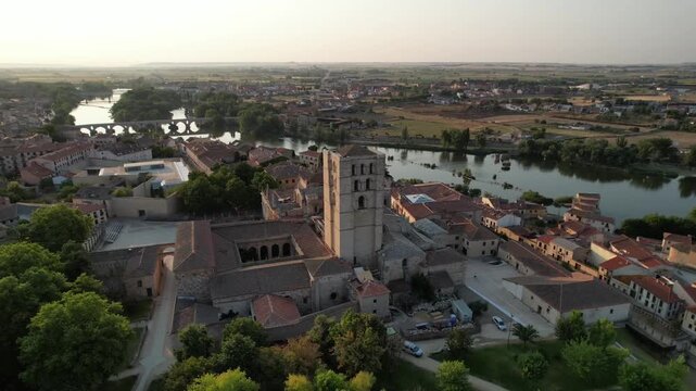 Cinematic drone orbit around the Zamora Cathedral overlooking the Douro River, Zamora, Spain