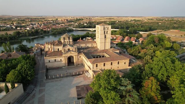 Cinematic drone orbit around the Zamora Cathedral overlooking the Douro River, Zamora, Spain