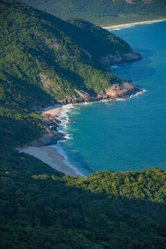 Vertical view of hidden tropical beach in Grumari Rio de Janeiro Brazil with copy space