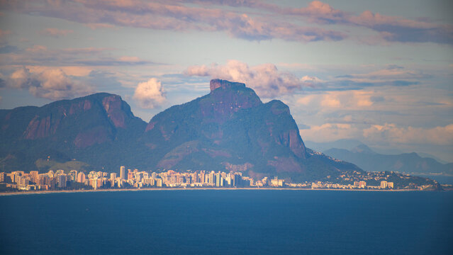  Panoramic view of Rio de Janeiro cityscape with Pedra da Gavea mountain and ocean in Brazil