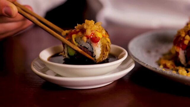 4K Video of a crispy dumpling being dipped into savory sauce, highlighting an Asian-style appetizer and delicious food.