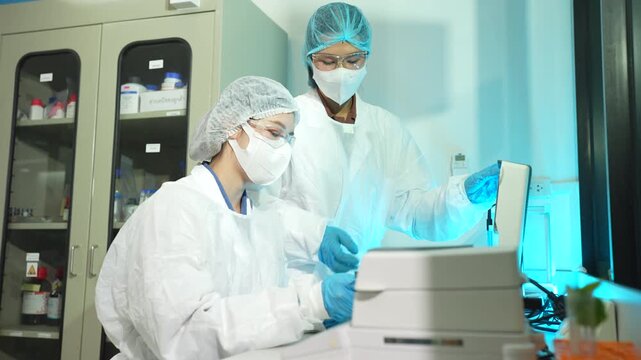Researcher testing water purity with microscope and petri dish culture samples in a sterile clean room laboratory, highlighting science, microbiology, analysis, and quality control.