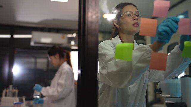 Researcher testing water purity through a microscope, monitoring soil moisture and crop health in a modern laboratory, advancing agricultural science and sustainability.