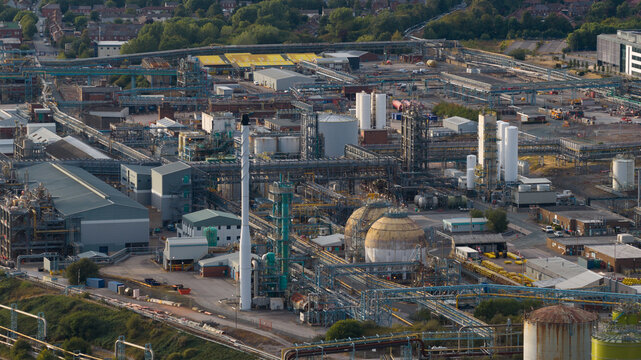 Aerial view of INEOS Electrochemical Solutions chemical plant featuring industrial infrastructure, storage tanks, and pipe networks in Runcorn, England, United Kingdom.