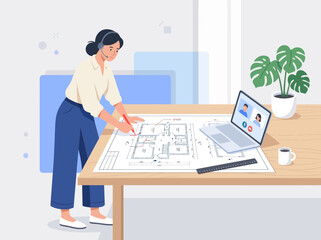 Fototapeta premium Architect woman with headset designs floor plan with remote team via laptop while working at desk