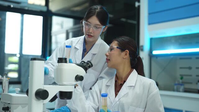 Scientists conduct chemical research and data analysis in a modern laboratory, driving innovation, biotechnology, healthcare, and scientific discovery through teamwork.