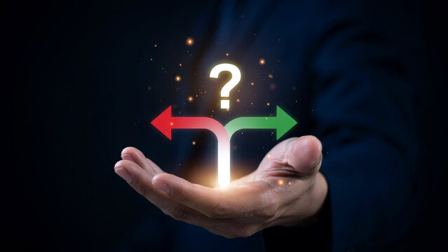 Businessman holding glowing question mark and split direction arrows