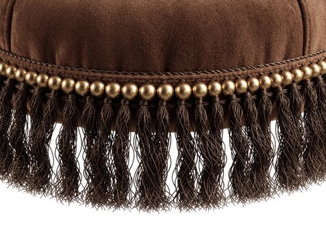 Rich brown suede fabric features golden bead trim with dangling threads. Elegant fringe detail adds luxury to upholstery or fashion items. Sophisticated textile texture for decor.