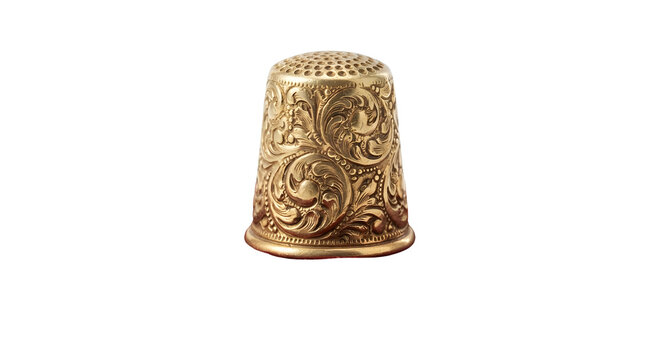 Ornate engraved golden brass sewing thimble on transparent background