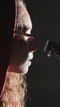 night telescope stargazer checks star charts, closeup of hands flipping pages and calibrating eyepiece, logbook entries under flashlight, focused researcher in hood, procedural mood with data driven
