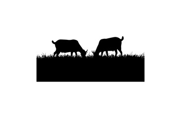Naklejka premium Silhouette of two cows grazing on grass against a dark backdrop, minimalist black and white silhouettes
