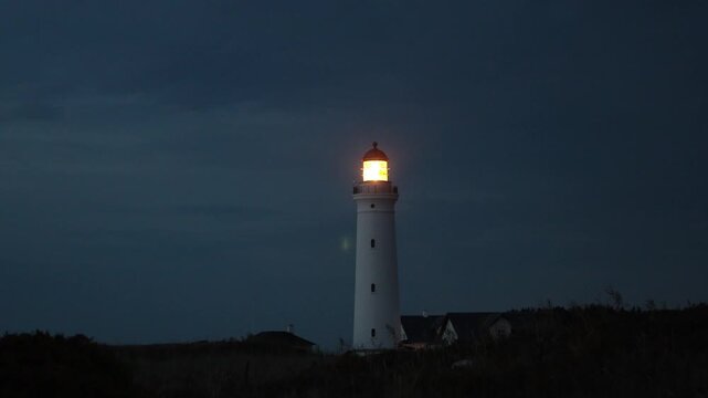 Hirtshals, Denmark A night view of the Hirtshals Fyr, or Hirtshals Lighthouse, and light beam.  