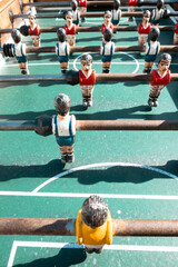 Fototapeta premium Vintage table soccer players on green field The Concept of competition and nostagia