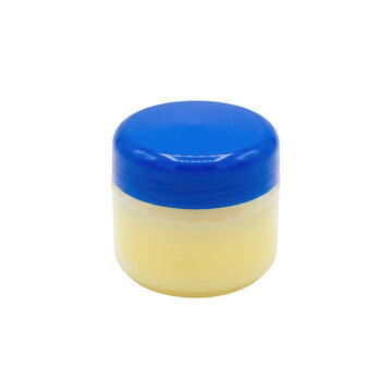 Small plastic jar of yellow petroleum jelly isolated on transparent background