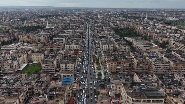 Aerial drone view of tourism police and security forces securing the area around Aleppo Citadel. Police ensuring public safety at a famous historic landmark in Syria.