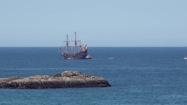 Historic Galleon with Spanish flag sailing close to the coast of Ireland in County Donegal
