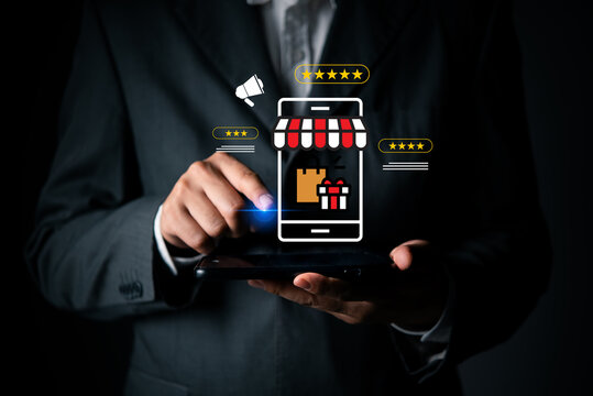 Businessman using smartphone online shopping ecommerce storefront customer rating icons smart composite digital marketing promotion retail business mobile application commercial advertising