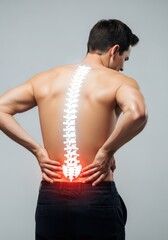 Fototapeta premium Man Suffering from Lower Back Pain with Glowing Spine Illustration for Medical and Healthcare Concepts