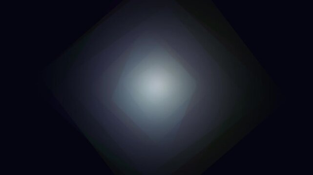 A soft gray light gradient glows gently against a deep black background creating a subtle luminous diamond shape.