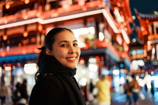Happy Asian Woman Walking in Yuyuan Garden Old Street During Night City