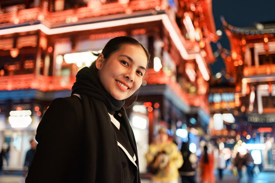 Happy Asian Woman Walking in Yuyuan Garden Old Street During Night City