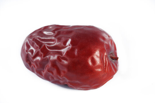 Dried red jujubes on white background