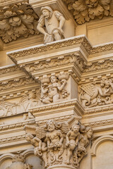 Fototapeta premium Detailed Baroque stone carvings on Basilica di Santa Croce facade in Lecce, Italy