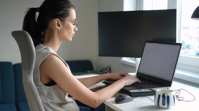 Young businesswoman working on a laptop